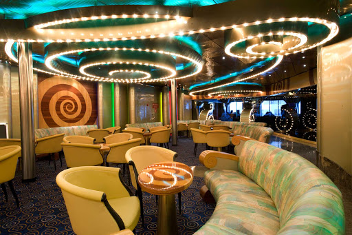 Meet your friends for dancing and drinks at Carnival Imagination's Shangri La Lounge.