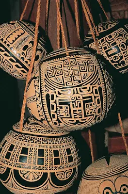 Hollowed out coconuts become Marquesan art in the hands of local carvers.