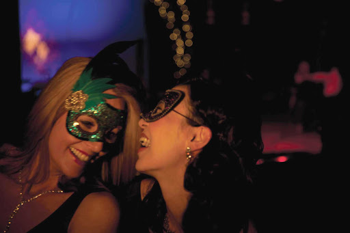 Have a blast in a fancy costume at one of Queen Mary 2's themed balls.