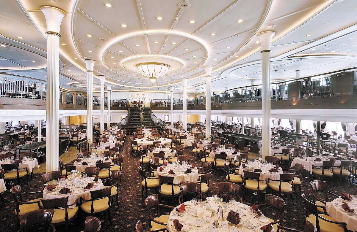 Enchantment-of-the-Seas-My-Fair-Lady-restaurant - Dine at the My Fair Lady dining room on decks 4 and 5 of Enchantment of the Seas, which a grand staircase and waterfall that that recall scenes in the movie.  