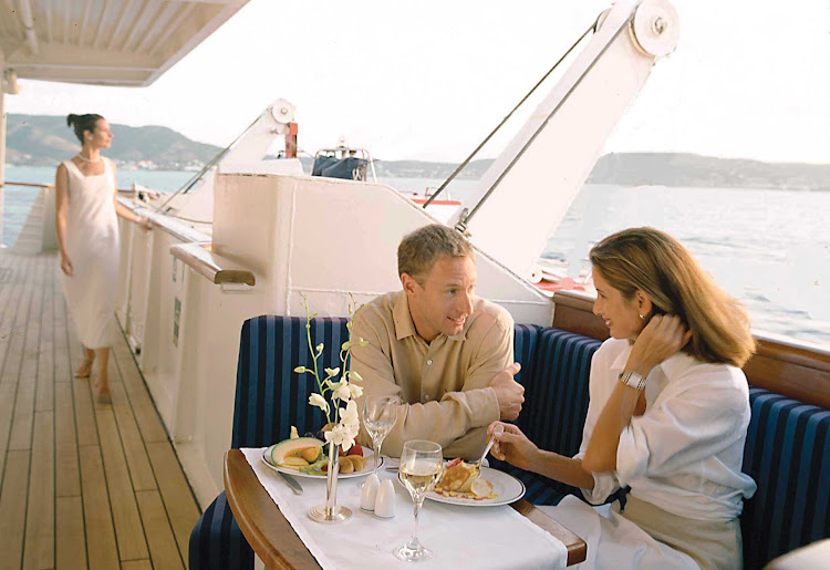 Enjoy private al fresco dining options such as this alcove on board your SeaDream cruise.