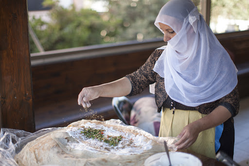 A Druze woman makes cheese in Northern Israel.