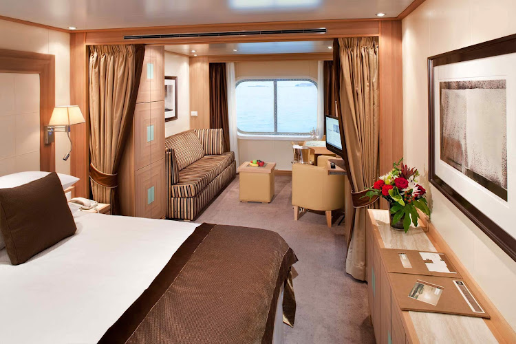 The Ocean View Suites on Seabourn Odyssey, Sojourn, and Quest feature a spacious living room with dinning area for two, your choice of beds, a fully stocked bar and refriderator, and an interactive media center.