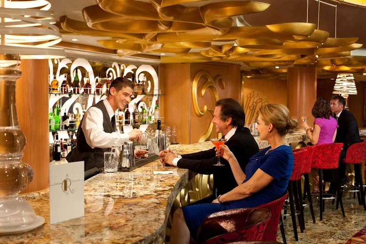 Pop into the R Bar aboard Grandeur of the Seas for a drink or lively conversation while soaking up its chic 1960s atmosphere.