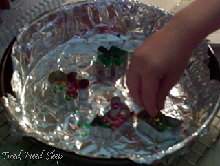 filling the cookie cutters up with beads