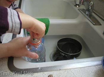 placing pebbles in empty jar