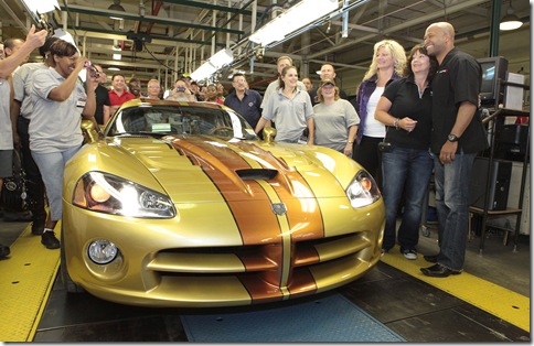 July 1 Ð Detroit Ð Dodge Brand President and CEO Ralph Gilles (right) and plant manager Shelly Brown Gordon (third from right) welcomed more than 400 hundred loyal Viper owners at the Conner Avenue Assembly Plant in Detroit today to present the ultimate factory customized 2010 Dodge Viper coupe to proud new owner D'Ann Rauh (second from right). Rauh and her husband Wayne from Arp, Texas, own more than 40 Dodge Vipers - the largest personal collection of Vipers in the world. A member of the Mid-South Viper Club of America, D'Ann Rauh worked exclusively with the Dodge Design team to select the personal touches she wanted on her car. The custom bronzed gold exterior paint was supplied by House of Kolor. The custom interior features various leather appointments, which were crafted by Tony Spampinito from Venzano, who has worked with the Rauhs on previous Viper projects. Bob Soroka, from Chrysler Group LLC's Street and Racing Technology team, airbrushed layouts of Viper-significant race tracks into the custom-painted copper stripes applied by Prefix. The five-spoke forged-aluminum wheels are custom painted in dark graphite. Members from both the Motor City Viper Club and the Viper Club of America participated in the celebration. Rauh's Viper is the last of the current-generation Vipers built at the plant. Dodge has created more special-edition Viper models for the 2010 model year than all other model years combined. Production on the Dodge Viper started in 1992. The Conner Avenue Assembly Plant will be idled while Dodge investigates a future-generation Viper. (Joe Wilssens photo)  For more information contact Dan Reid at 248-512-0366.