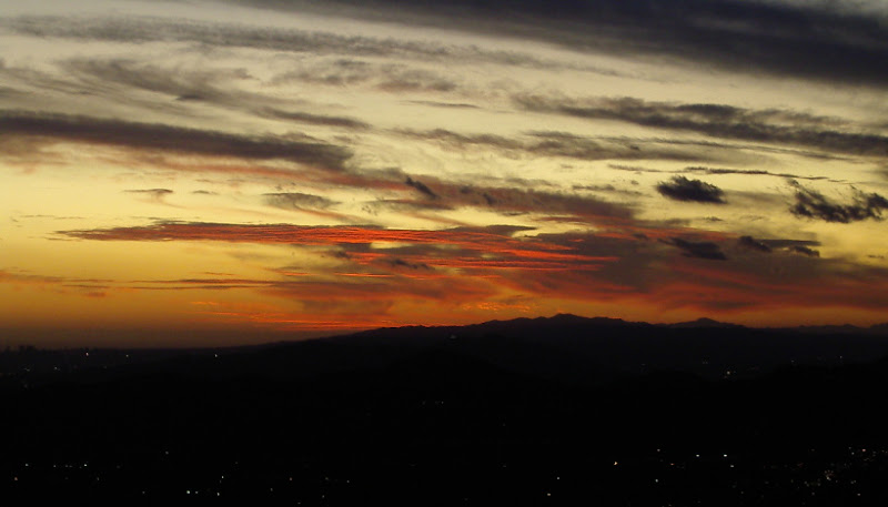 The very last of the sunlight disappearing behind the hills.