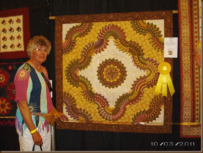 Caryls quilt with ribbon