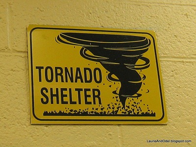 Tornado Shelter sign over the restrooom doors at Camping World