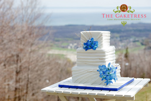 The blue orchids on the cake were handmade and painted out of sugar paste 