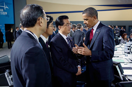 President Barack Obama talks with Chinese President Hu Jintao during the morning plenary session of the G-20 Pittsburgh Summit at the David L. Lawrence Convention Center in Pittsburgh.