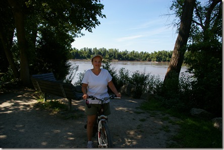 Deanna on an inexpensive WalMart bike with the Missouri River in the background