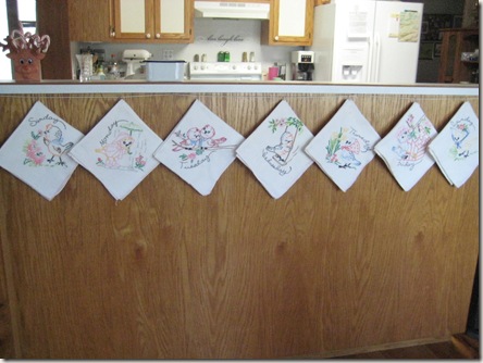 embroidered tea towels hanging up