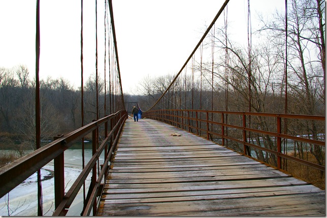 Jim walking across swinging bridge