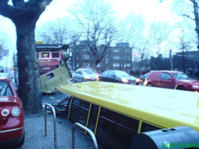 Photo shows the roof of the bus on the road behind it just after the crash. Many of the windows are still intact. Photo taken at 08:09