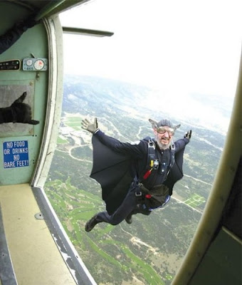 image shows an Irish skydiver dressed somewhat like Dracula who has just jumped out of the plane