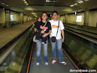DavaoBase invades Hong Kong! Riding on a walkalator at the HK International Airport.