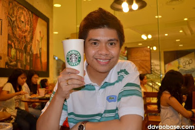 Hubby enjoying a Venti Hot White Chocolate Mocha at Starbucks Coffee in Abreeza Mall