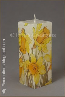 Decoupage candle with daffodils.