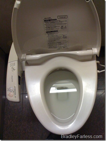 A toilet with butt sprayer, butt blow dryer and heated seat at Narita Airport in Tokyo, Japan. A toilet with butt sprayer, butt blow dryer and heated seat at Narita Airport in Tokyo, Japan.