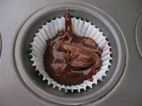 overhead photo of cake batter in a muffin tin
