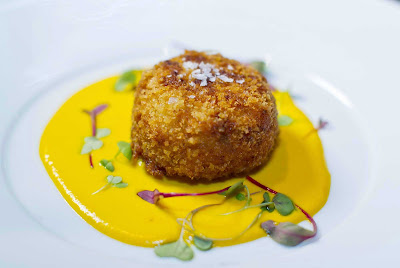 An appetizer with a rich, zesty sauce served at 150 Central Park aboard Oasis of the Seas, under the direction of James Beard Award-winning chef and Miami restaurateur Michael Schwartz.