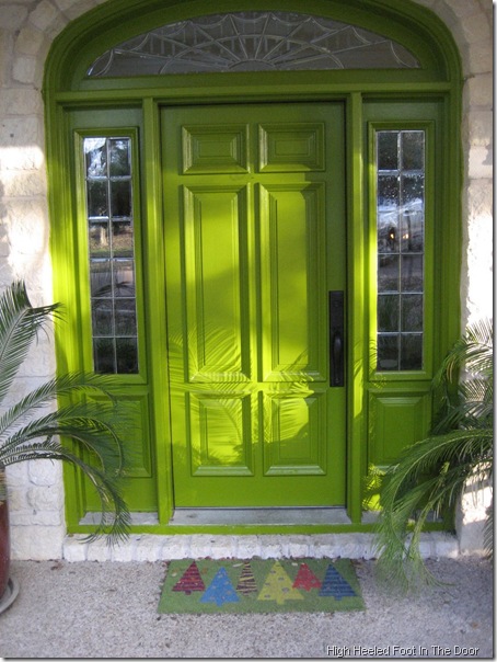 bright green high heeled foot in the door