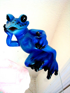 lounging frog statue