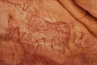 Gilf Kebir cave painting showing wild beast devouring humans