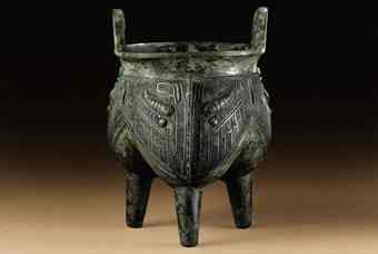 One of the most famous bronzes in the collection is the striking 'li', a ritual tripod vessel for cooking grains or meat, from the late Shang dynasty, 12th century BC