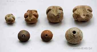 Spindle wheels and net weights made in ancient China's Han Dynasty (206 BC-220 AD) and excavated at Caoxie Village in Lianzhou Town of Hepu County, southwest China's Guangxi Zhuang Autonomous Region