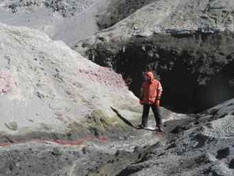 A photo of the Rio Agrio, a highly acidic (pH=1) stream on Copahue Volcano. Standing safely over the water is Johan Varekamp of Wesleyan University, who proposed a few years ago that Copahue is a good terrestrial analog for Mars.