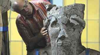 Archeologist Lutz Martin works on a statue from the Tell-Halaf project in Berlin.