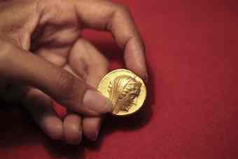 A 2200 year old coin is seen at the Israel Museum, in Jerusalem, Wednesday, Aug. 11, 2010. Archaeologists say they have excavated the heaviest and most valuable gold coin to date in Israel. 