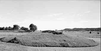 Three passage graves in a row at Karleby on Falbygden in Sweden. In the background to the right is the mountain Ålleberg.