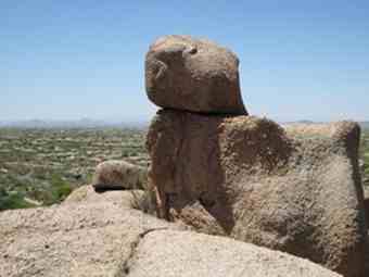 The walking path at The Boulders resort includes several rock formations that are precariously perched on one another.