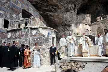 Ecumenical Greek Orthodox Patriarch Bartholomew I (3-R), the spiritual leader of the world's Orthodox Christians, leads a service at the ancient Sumela Monastery in the Black Sea coastal province of Trabzon, Turkey on 15 August 2010. Thousands of Orthodox Christians hold a rare Mass at an ancient monastery in Turkey after the government allowed worship there once a year in a gradual loosening of restrictions on religious expression.
