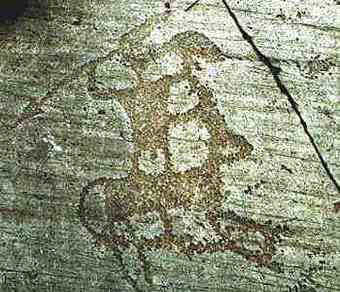 Warrior standing on a horse on Naquane rock n. 1 (Iron Age)
