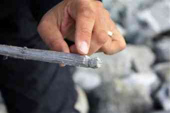 Norwegian archaeologist Elling Utvik Wammer shows off a stick believed to be about 1,500 years old and used in reindeer hunts by ancestors of the Vikings in the Jotunheimen mountains of Norway September 9, 2010. 