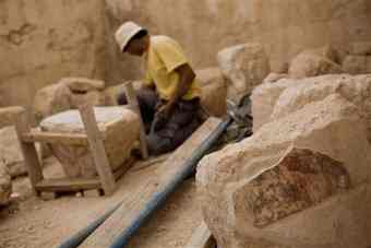 Archaeologist Tal Rogovski works inside a hall in the Herodium complex, in the West Bank, south of Jerusalem, Tuesday, Sept. 21, 2010. Israeli archaeologists have excavated a lavish private box in a 400-seat theater located at King Herod's winter palace in the Judean desert. Head archaeologist Ehud Netzer says Herod commissioned Roman artists to decorate the theater walls with elaborate paintings and plaster moldings around 15 B.C. 