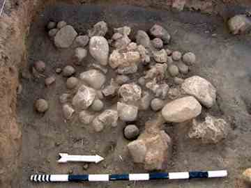 Clay balls and stones found in a pile during excavation 