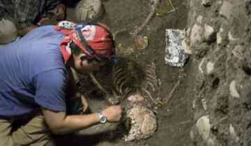 Siberian archeologists excavate the ancient tomb in the Krasnoyarsk region .