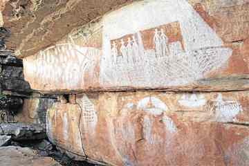 The painting of a boat with was appears to be seveal men with top hats. 