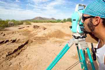 Archaeologist Dave Bustoz, of Mesa, surveys the Palo Verde Open Space and Park in Peoria.
