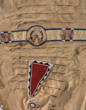 A triangle of red “trade” cloth identified with the mid-1800s helped confirm the date