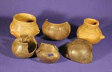 Miniature cups. The strangers who came to Herxheim to die brought only the finest pottery from their home regions -- in many cases even more beautiful than the pottery they placed inside the graves of their own dead at home. 