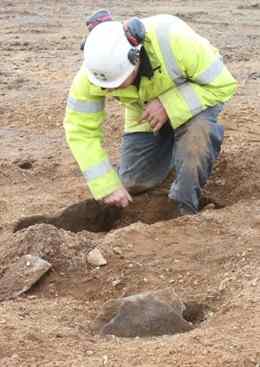 roject officer Marc Storey examines the Neolithic cremation urns found near the Balthane industrial estate in Ballasalla.