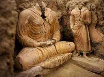 Ancient Buddha statues inside a temple in Mes Aynak, south of Kabul, Afghanistan. This archaeological site is located at the world's second-largest unexploited copper mine in Logar province. The Chinese government-backed mining company, China Metallurgical Group Corp., which won the contract to exploit the site, has given archaeologists three years to finish the excavations. Photo: Dusan Vranic / AP 
