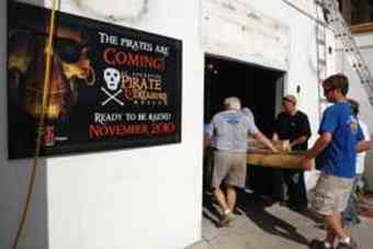 Work crews move a piece of a pirate ship inside a building being renovated to house the new St. Augustine Pirate and Treasure Museum located at 12 Castillo Drive in downtown St. Augustine.
